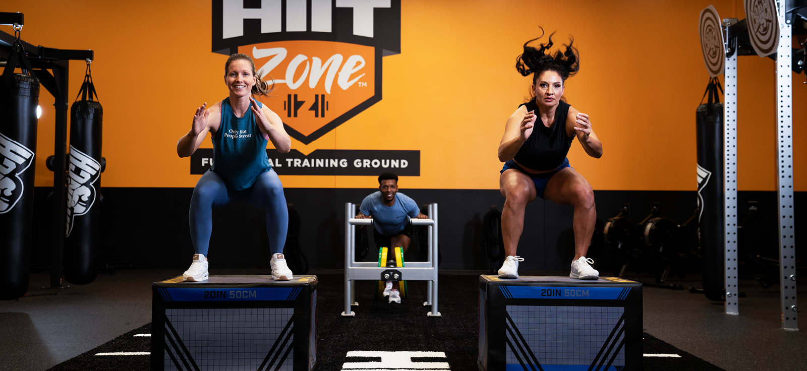 women doing jump squats