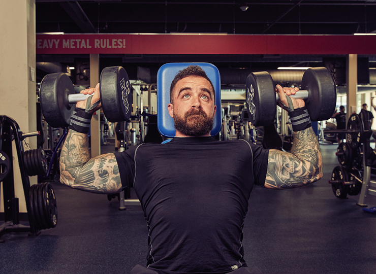 Man doing seated overhead dumbbell press
